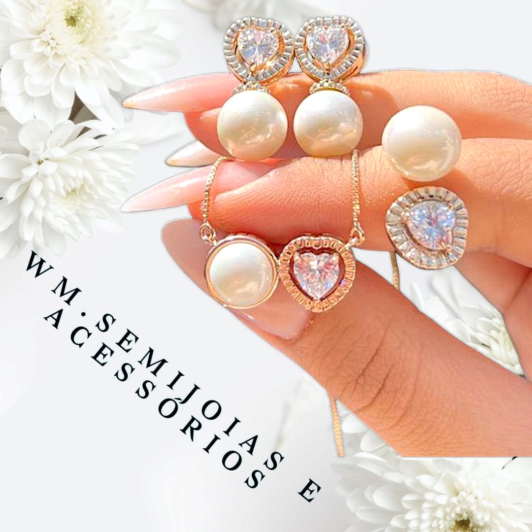 Conjunto pérola e zircônia cristal em banho ouro com cravação em microzircônias.